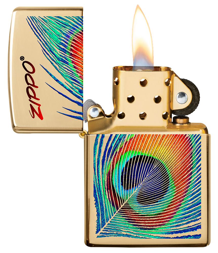 Peacock Feather Design Windproof Pocket Lighter with its lid open and lit.